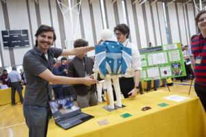 student showing project at innovation showcase